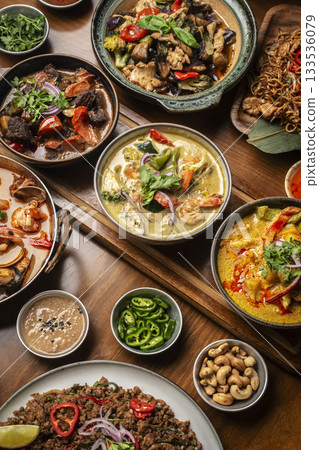 many different thai food dishes on table in modern restaurant in bangkok thailand 133536079