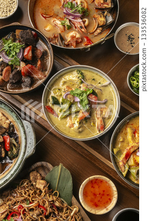 many different thai food dishes on table in modern restaurant in bangkok thailand 133536082