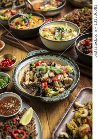 many different thai food dishes on table in modern restaurant in bangkok thailand many different thai food dishes on table in modern restaurant in bangkok thailand 133536083