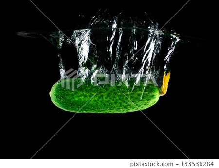 Cucumber falling in water Cucumber falling in water 133536284