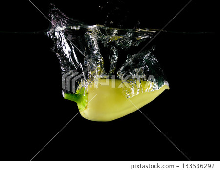 Pepper yellow falling in water Pepper yellow falling in water 133536292
