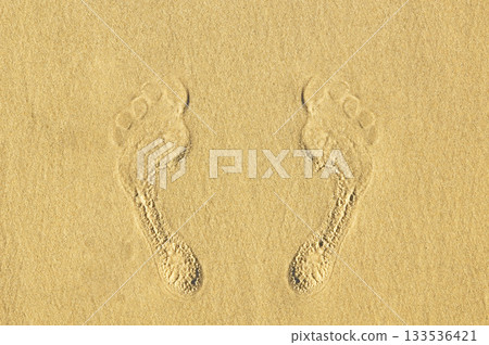 Human footprints on the sand at the beach Human footprints on the sand at the beach 133536421