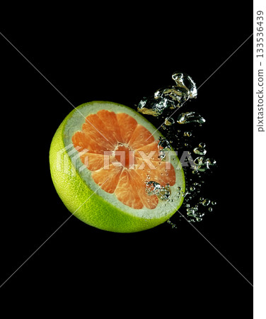 Half of citrus fruit in water Half of citrus fruit in water 133536439