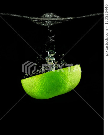 Half a lime fruit in water Half a lime fruit in water 133536440