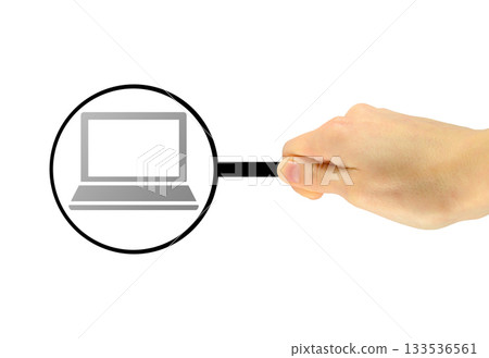Man's hand with a magnifying glass examines computer Man's hand with a magnifying glass examines computer 133536561