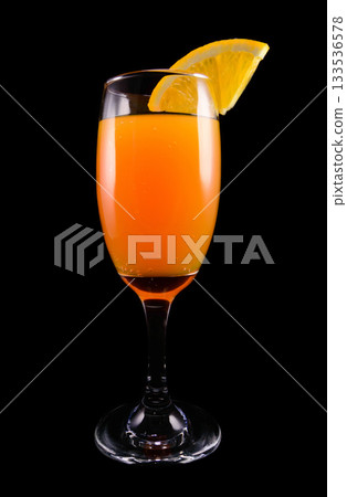 Mimosa cocktail with a slice of orange Mimosa cocktail with a slice of orange 133536578