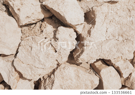 Old natural stone masonry without mortar between the stones, natural background Old natural stone masonry without mortar between the stones, natural background 133536661