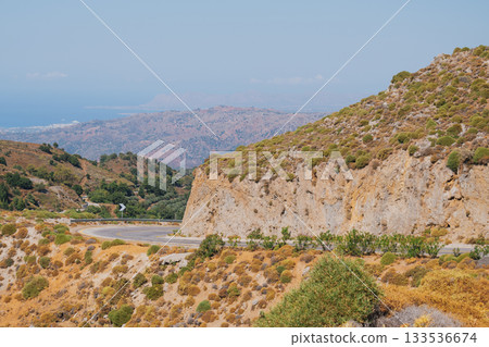 Road section winding around mountain in Crete near Omalos White Mountains. Road section winding around mountain in Crete near Omalos White Mountains. 133536674