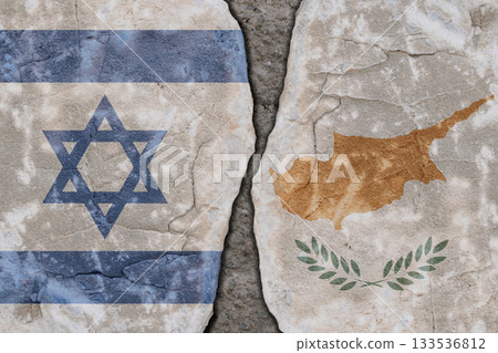 Symbolic split between Israel and Cyprus flags on cracked stone wall texture 133536812