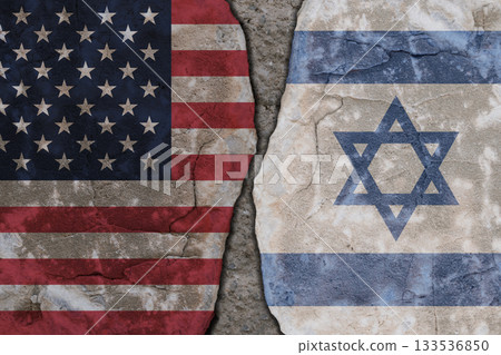 Symbolic split between USA and Israel flags on cracked stone wall texture 133536850