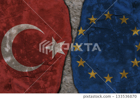 Symbolic split between Turkey and European Union flags on cracked stone wall texture Symbolic split between Turkey and European Union flags on cracked stone wall texture 133536870