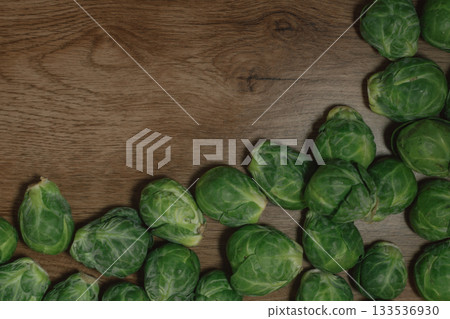Top view of vibrant green brussel sprouts forming a natural food border Top view of vibrant green brussel sprouts forming a natural food border 133536930