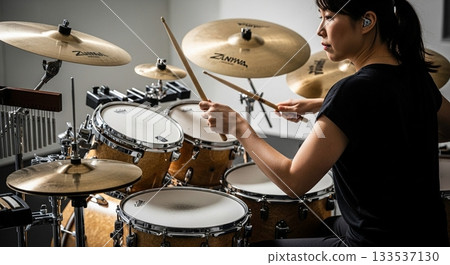 woman playing the drum 133537130
