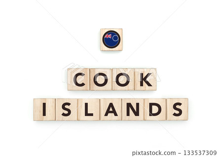 Wooden blocks bearing the name and flag of Cook Islands. Cook Islander and Polynesian Culture, national identity, travel, and geography in a copy space design. 133537309