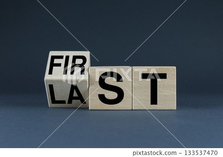 Cubes form the words First or Last. Business success concept Cubes form the words First or Last. Business success concept 133537470