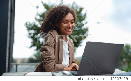 coder working outside, software engineer diligently coding outside near glass skyscraper with coffee coder working outside, software engineer diligently coding outside near glass skyscraper with coffee 133537499