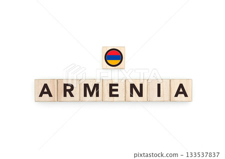 Wooden blocks bearing the name and flag of Armenia. Armenian and Asian Culture, national identity, travel, and geography in a copy space design. 133537837
