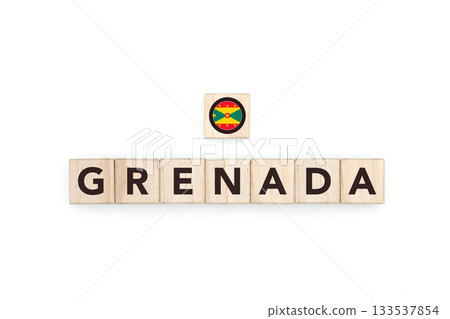 Wooden blocks bearing the name and flag of Grenada. Grenadian and Caribbean Culture, national identity, travel, and geography in a copy space design. Wooden blocks bearing the name and flag of Grenada. Grenadian and Caribbean Culture, national identity, travel, and geography in a copy space design. 133537854