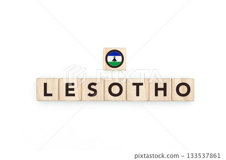 Wooden blocks bearing the name and flag of Lesotho. Basotho and South African Culture, national identity, travel, and geography in a copy space design. Wooden blocks bearing the name and flag of Lesotho. Basotho and South African Culture, national identity, travel, and geography in a copy space design. 133537861