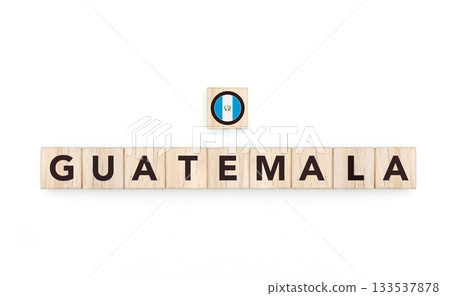 Wooden blocks bearing the name and flag of Guatemala. Guatemalan and Caribbean Culture, national identity, travel, and geography in a copy space design. 133537878
