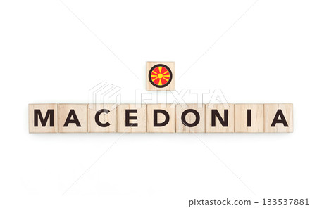 Wooden blocks bearing the name and flag of North Macedonia. Macedonian and Mediterranean Culture, national identity, travel, and geography in a copy space design. Wooden blocks bearing the name and flag of North Macedonia. Macedonian and Mediterranean Culture, national identity, travel, and geography in a copy space design. 133537881