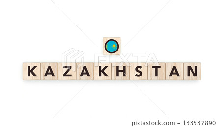 Wooden blocks bearing the name and flag of Kazakhstan. Kazakh and Asian Culture, national identity, travel, and geography in a copy space design. 133537890