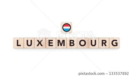 Wooden blocks bearing the name and flag of Luxembourg. Luxembourgger and European Culture, national identity, travel, and geography in a copy space design. 133537892