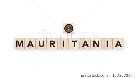 Wooden blocks bearing the name and flag of Mauritania. Mauritanian and African and Arab Culture, national identity, travel, and geography in a copy space design. Wooden blocks bearing the name and flag of Mauritania. Mauritanian and African and Arab Culture, national identity, travel, and geography in a copy space design. 133537894