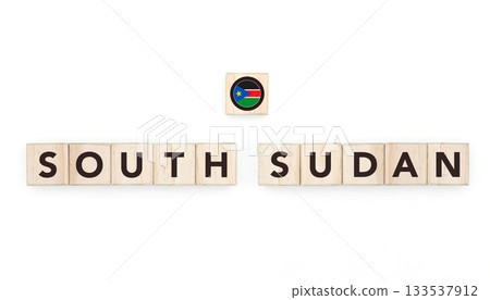 Wooden blocks bearing the name and flag of South Sudan. South Sudanese and African Culture, national identity, travel, and geography in a copy space design. 133537912