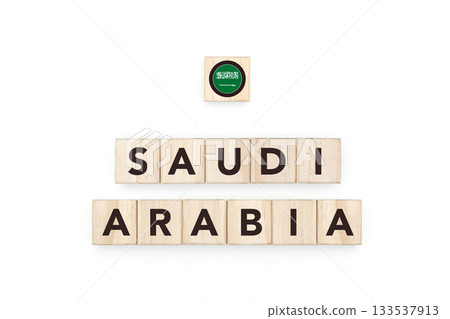 Wooden blocks bearing the name and flag of Saudi Arabia. Saudi and Arabian Culture, national identity, travel, and geography in a copy space design. 133537913