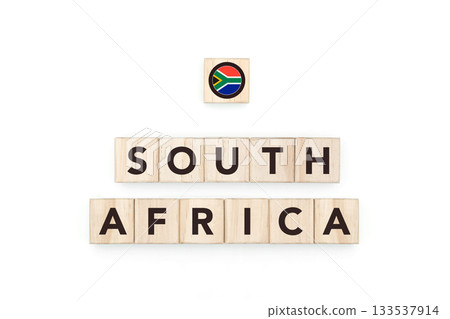 Wooden blocks bearing the name and flag of South Africa. South African Culture, national identity, travel, and geography in a copy space design. Wooden blocks bearing the name and flag of South Africa. South African Culture, national identity, travel, and geography in a copy space design. 133537914