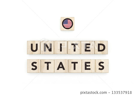 Wooden blocks bearing the name and flag of United States. American Culture, national identity, travel, and geography in a copy space design. Wooden blocks bearing the name and flag of United States. American Culture, national identity, travel, and geography in a copy space design. 133537918