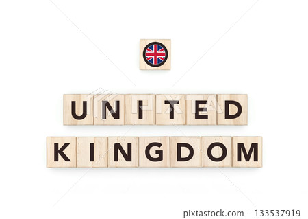 Wooden blocks bearing the name and flag of United Kingdom. British and European Culture, national identity, travel, and geography in a copy space design. 133537919