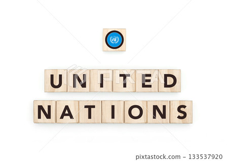 Wooden blocks bearing the name and flag of United Nations. Global Culture, world identity, travel, and geography in a copy space design. 133537920