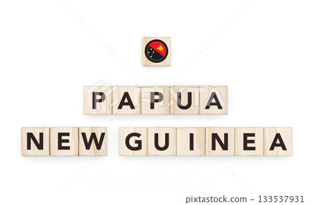 Wooden blocks bearing the name and flag of Papua New Guinea. Austral and Polynesian Culture, national identity, travel, and geography in a copy space design. Wooden blocks bearing the name and flag of Papua New Guinea. Austral and Polynesian Culture, national identity, travel, and geography in a copy space design. 133537931