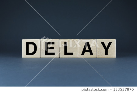 Delay. The cubes form the word Delay. 133537970