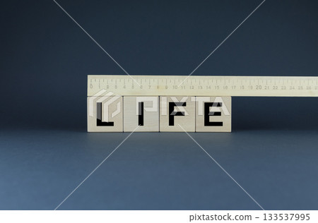 Life. Cubes with a ruler form the word Life 133537995