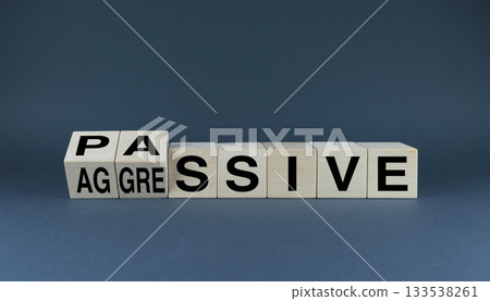 Passive or Aggressive Behavior. The cubes form the choice words Passive or Aggressive. Passive or Aggressive Behavior. The cubes form the choice words Passive or Aggressive. 133538261
