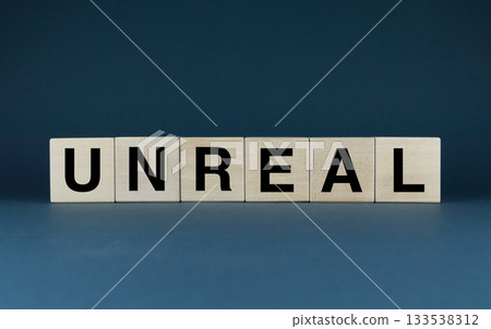 Unreal. Cubes form the word Unreal. Unreal word concept 133538312