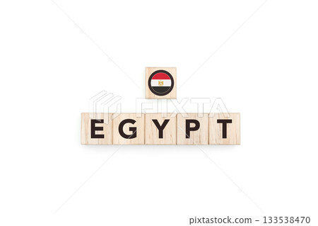 Wooden blocks bearing the name and flag of Egypt. Egyptian and African Culture, national identity, travel, and geography in a copy space design. Wooden blocks bearing the name and flag of Egypt. Egyptian and African Culture, national identity, travel, and geography in a copy space design. 133538470