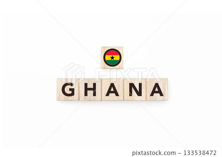 Wooden blocks bearing the name and flag of Ghana. Ghanaian and African Culture, national identity, travel, and geography in a copy space design. Wooden blocks bearing the name and flag of Ghana. Ghanaian and African Culture, national identity, travel, and geography in a copy space design. 133538472