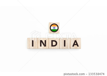 Wooden blocks bearing the name and flag of India. Cuban and Indian Culture, national identity, travel, and geography in a copy space design. Wooden blocks bearing the name and flag of India. Cuban and Indian Culture, national identity, travel, and geography in a copy space design. 133538474