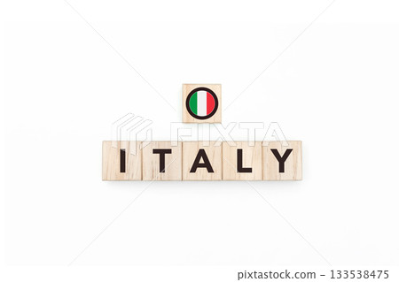 Wooden blocks bearing the name and flag of Italy. Italian and Latin Culture, national identity, travel, and geography in a copy space design. Wooden blocks bearing the name and flag of Italy. Italian and Latin Culture, national identity, travel, and geography in a copy space design. 133538475