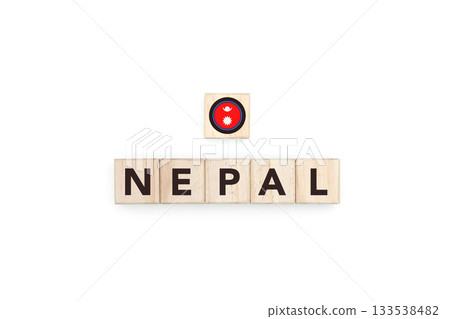 Wooden blocks bearing the name and flag of Nepal. Nepali and Asian Culture, national identity, travel, and geography in a copy space design. 133538482
