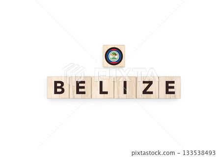 Wooden blocks bearing the name and flag of Belize. Belizean and Caribbean Culture, national identity, travel, and geography in a copy space design. 133538493