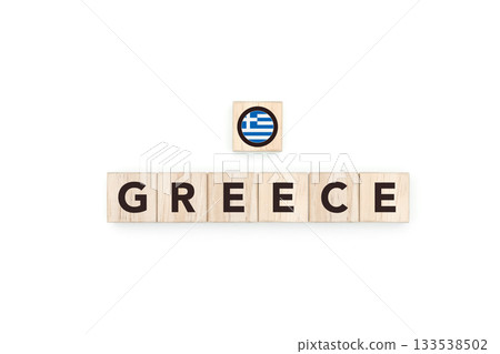 Wooden blocks bearing the name and flag of Greece. Greek and Mediterranean Culture, national identity, travel, and geography in a copy space design. Wooden blocks bearing the name and flag of Greece. Greek and Mediterranean Culture, national identity, travel, and geography in a copy space design. 133538502