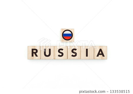 Wooden blocks bearing the name and flag of Russia. Russian and European and asian Culture, national identity, travel, and geography in a copy space design. 133538515