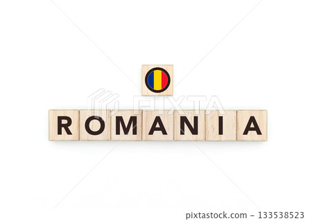 Wooden blocks bearing the name and flag of Romania. Romanian and East European Culture, national identity, travel, and geography in a copy space design. 133538523