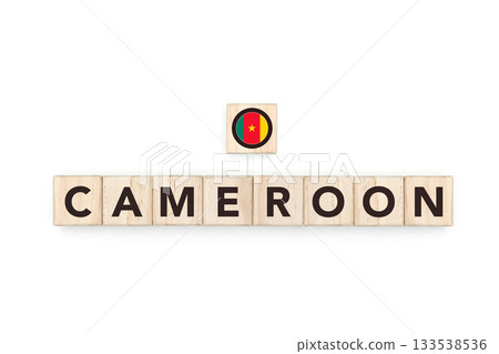 Wooden blocks bearing the name and flag of Cameroon. Cameroonian and African Culture, national identity, travel, and geography in a copy space design. 133538536