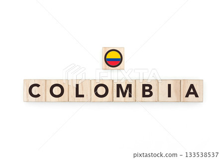 Wooden blocks bearing the name and flag of Colombia. Colombian and South American Culture, national identity, travel, and geography in a copy space design. Wooden blocks bearing the name and flag of Colombia. Colombian and South American Culture, national identity, travel, and geography in a copy space design. 133538537